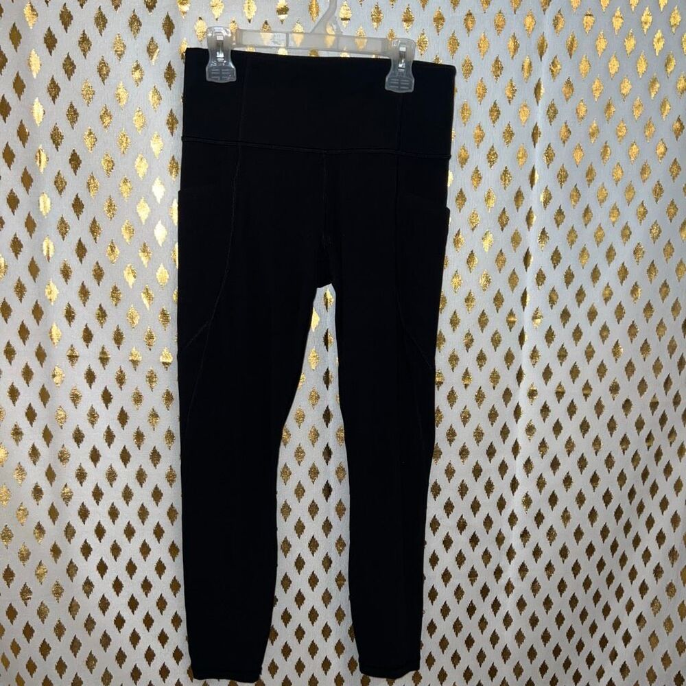 Athleta leggings black skinny pocket stash salutation 7/8 fit size S